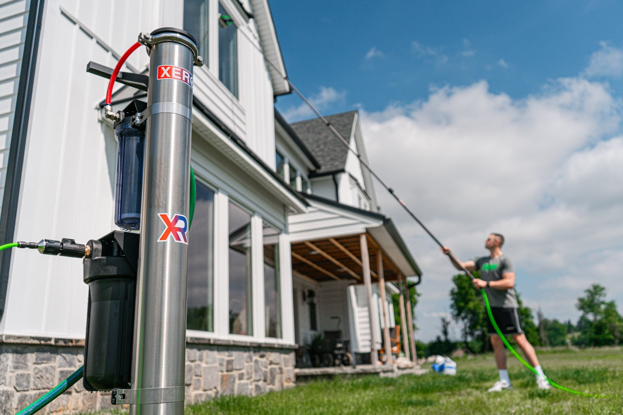 User cleaning windows with the XERO Pure in the foreground