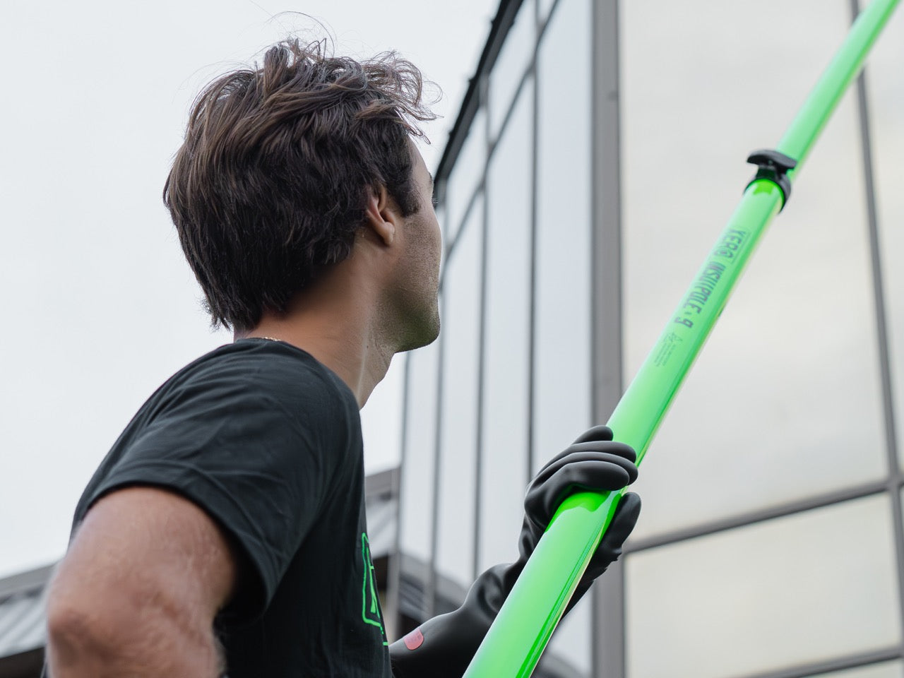 Water Fed Window Cleaner Using PPE and an InsuPole to Clean Windows