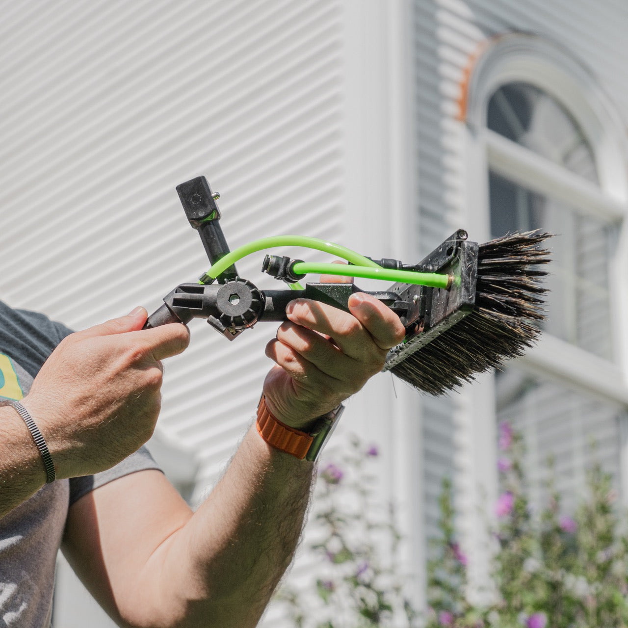 XERO Fast Lock being clicked into place for a XERO Brush and XERO Water Fed Pole. 