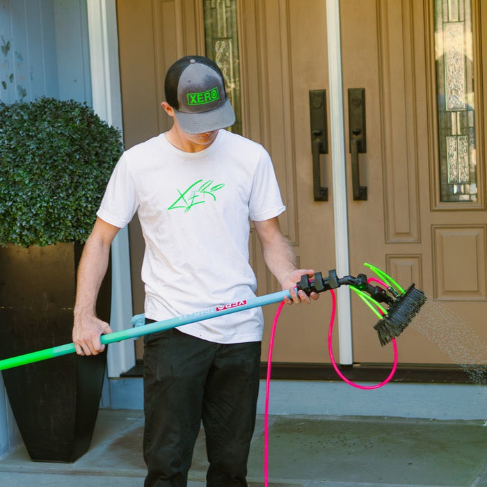 XERO Icon Tee on a Window Cleaner as he  sets up his water fed pole